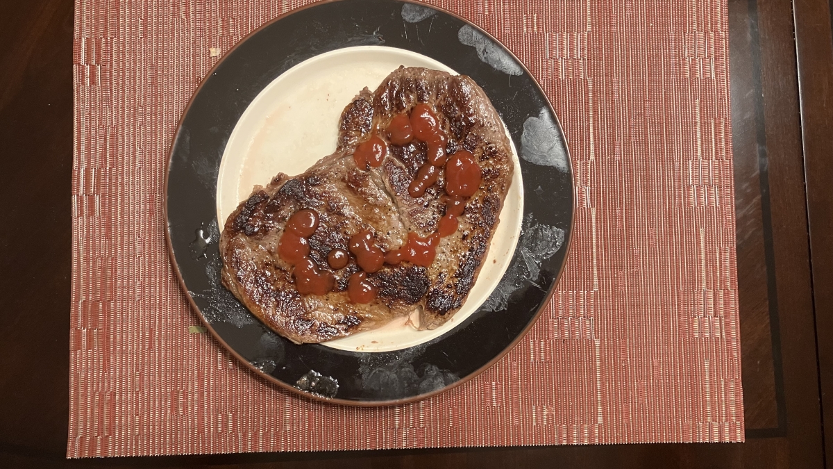 Well done steak with ketchup