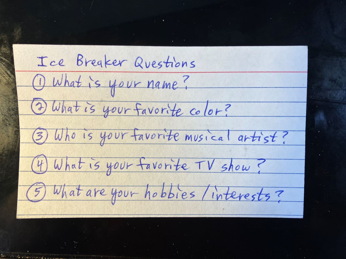 note card with ice breaker questions